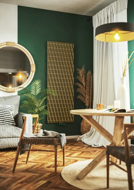 Designradiator Willow V in de groene afwerking Green Chlorophyll, verticaal aan de wand in een woonkamer