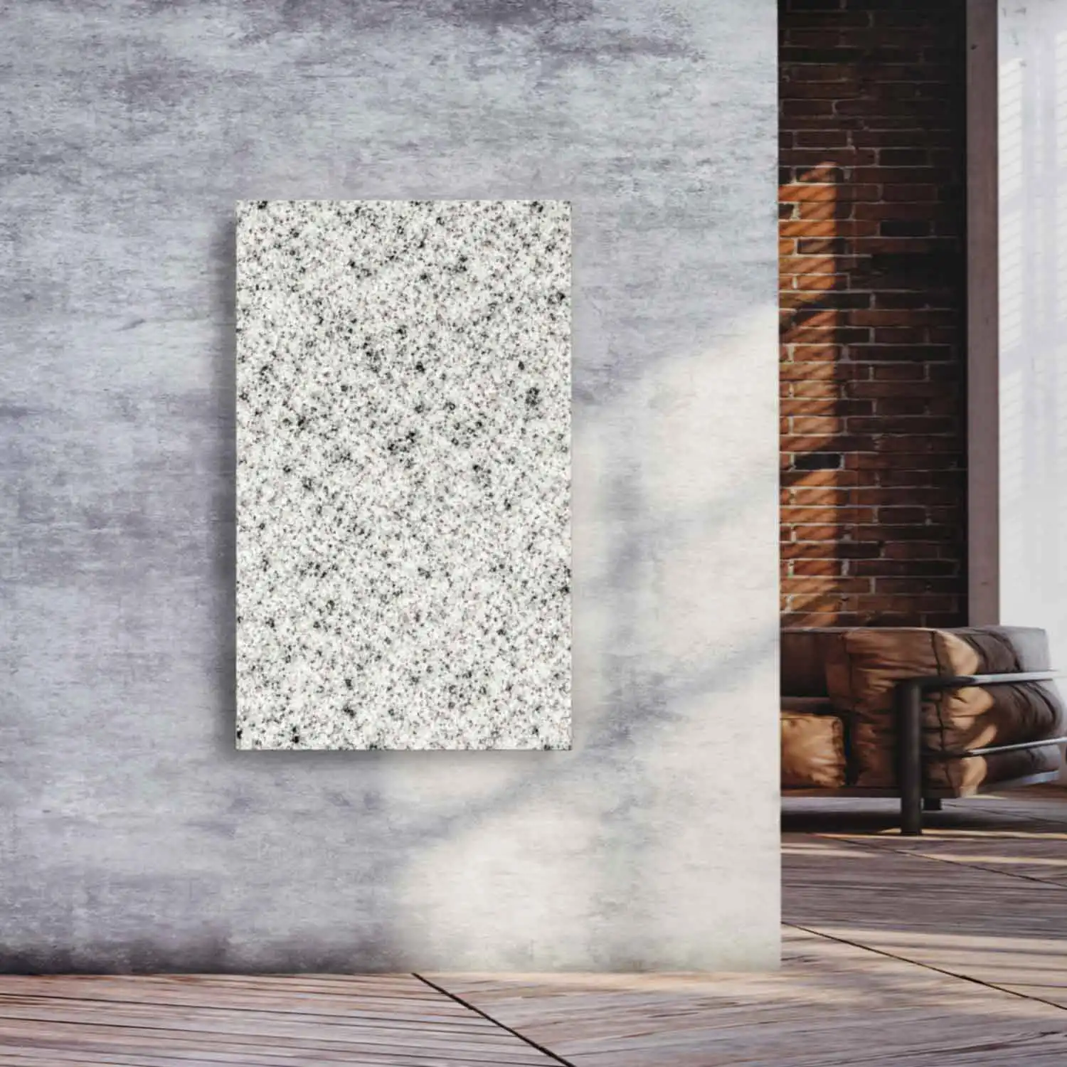 Designradiator Bethel White in lichte graniet aan een betonnen wand in een woonruimte